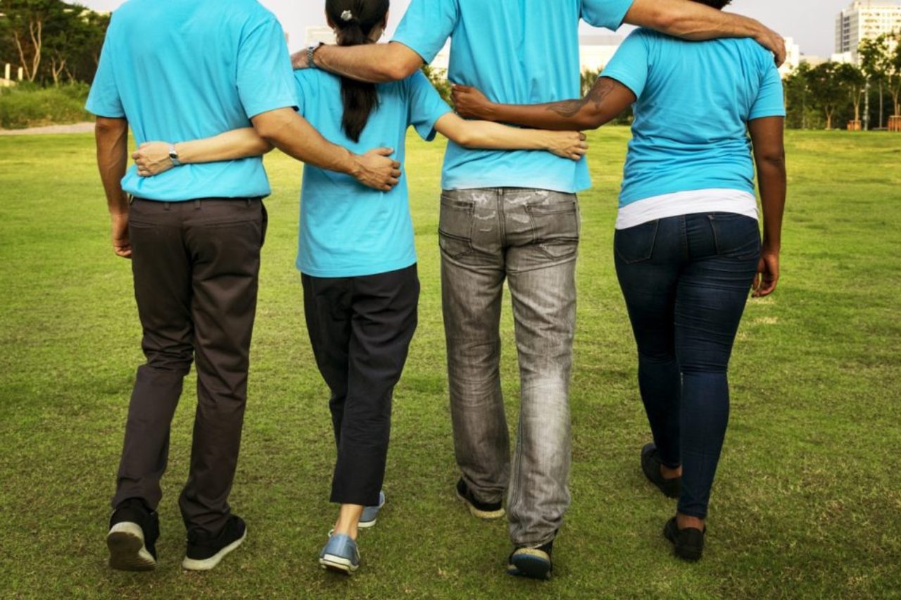 back-view-group-walking-arm-in-arm-pexels-photo-1282267